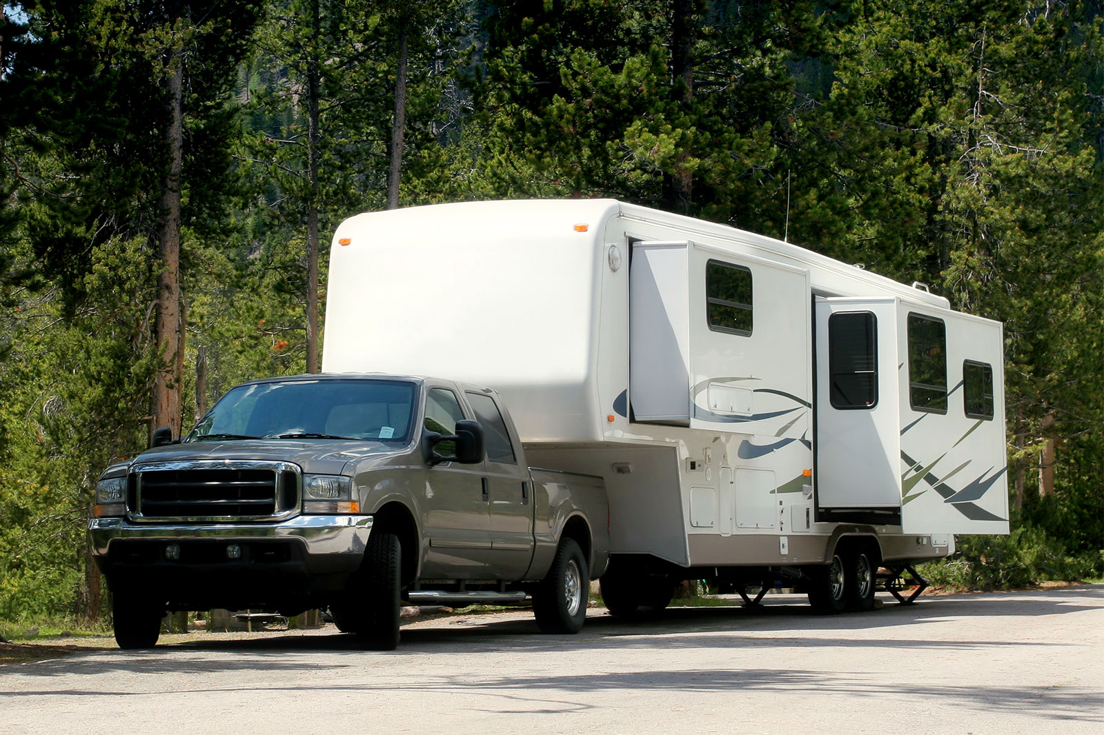 RV towing a car on the highway